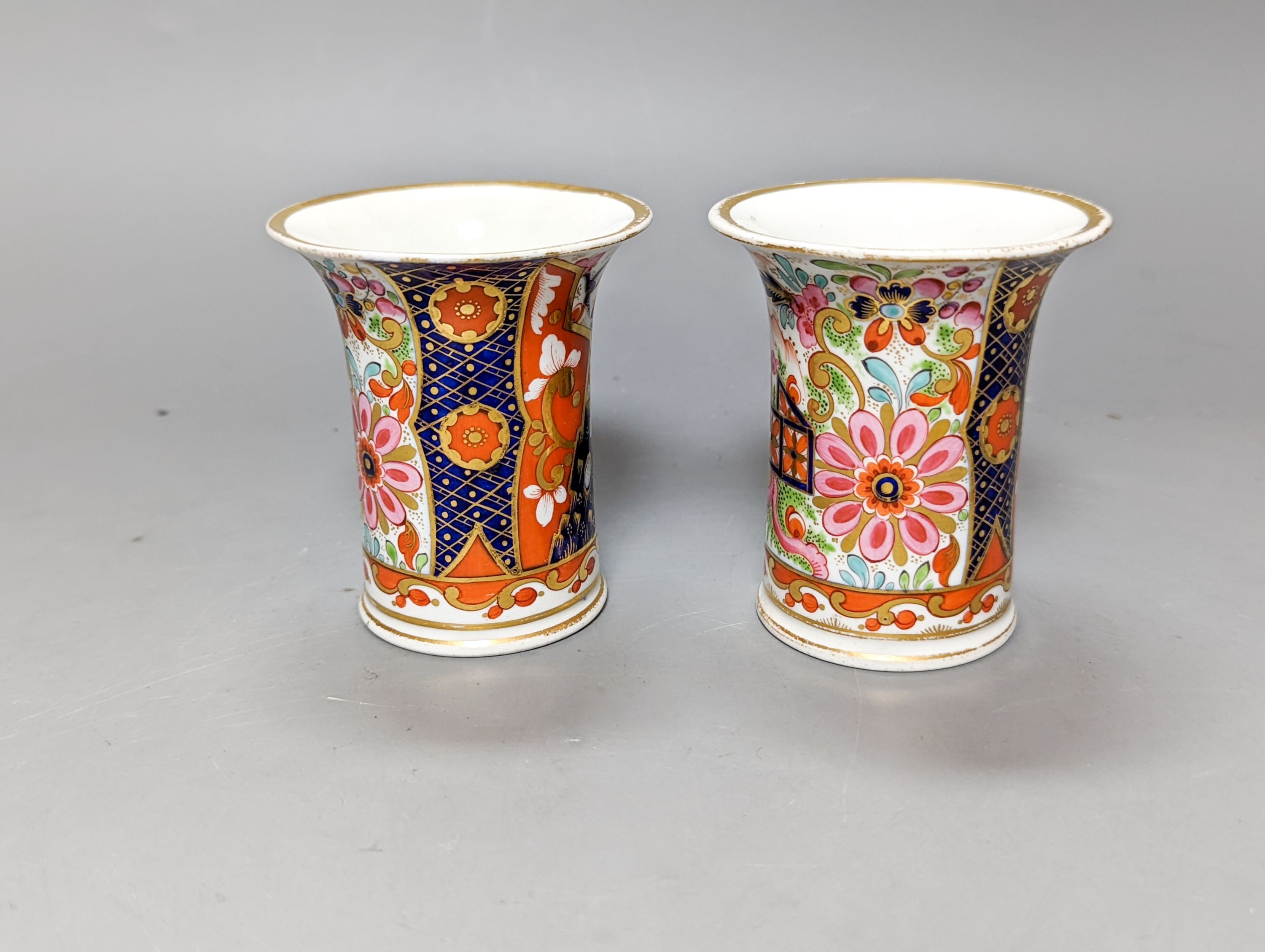 A pair of Chamberlain's Worcester miniature vases and Barr, Flight & Barr Worcester tea cup and saucer, early 19th century